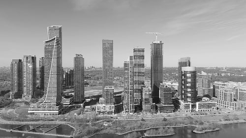 Humber Bay shores condos. Drone aerial orbiting buildings. Black and white. 4K.