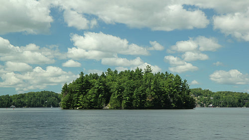 Summer island in Muskoka, Ontario, Canada. Time lapse clouds. HD video.