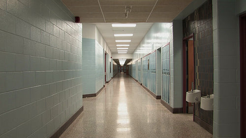 High school hallway with doors at end. Zoom in. Toronto, Ontario, Canada. HD video.