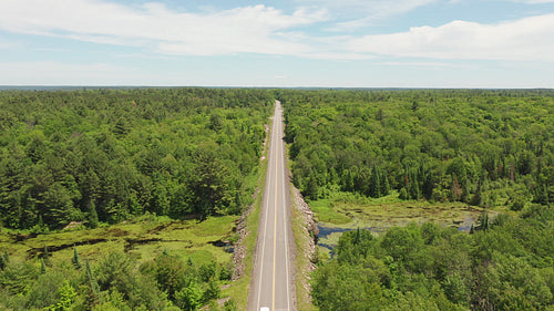 Summer highway in rural Ontario. Drone aerial birds eye view. Moving forward. 4K video.