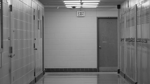 High school hallway. Zoom out. Toronto, Ontario, Canada. Black and white. HD video.