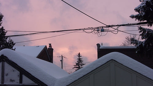 Pink winter sky in the suburbs. HD video.