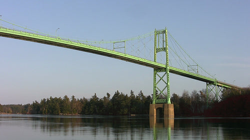 Thousand Islands Bridge detail. Green suspension bridge over Saint Lawrence river. HD video.
