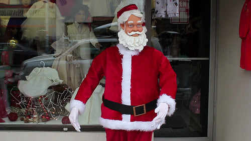 Robot santa dances outside store. Christmas shopping in Toronto, Ontario, Canada. HD video.