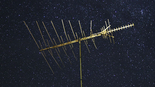 Vintage TV antenna with night sky stars time lapse. HD video.
