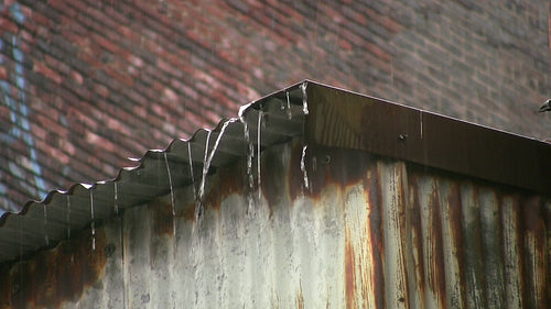 Heavy rain on rusty corrugated iron roof. Good audio. HD video.