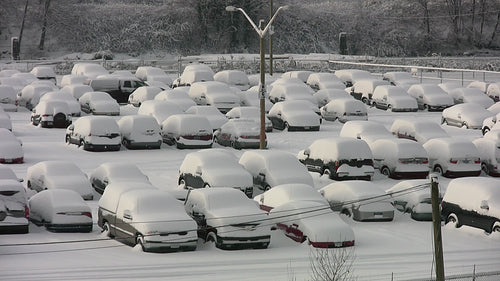 Snowstorm parking lot. Truck drives around snowy parking lot. HD video.