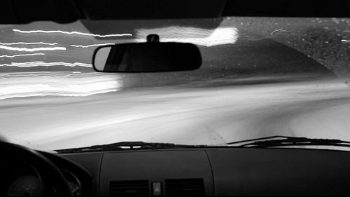 Winter POV driving. Toronto highway 401 time lapse. No visible logos. Black & white. HD video.