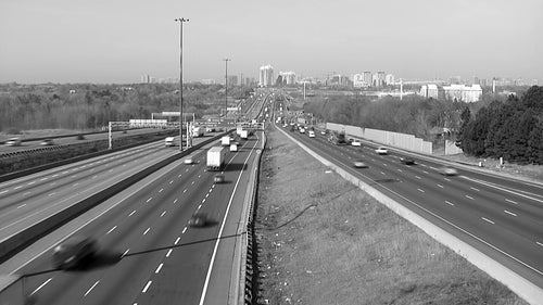 Highway 401. Winter in Toronto. Time lapse traffic. Black and white. HD video.