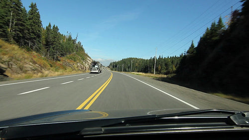 Passing truck on sunny Northern Ontario highway. HD.
