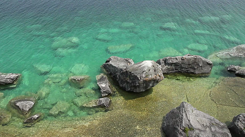 Overhead view from cliff of rocks and water of Georgian bay. HD.