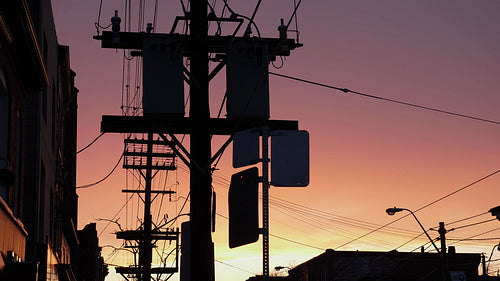 City silhouette of transformers and phone wires with sunset. Toronto. 4K.