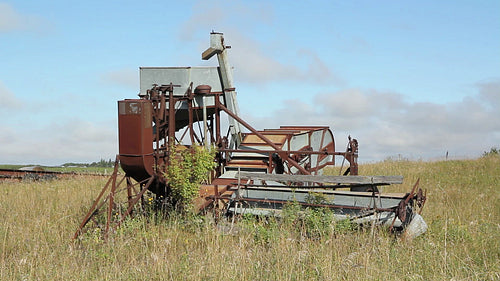 Old rusty farm equipment in Saskatchewan, Canada. HD.