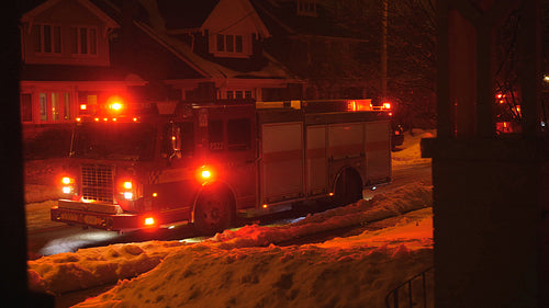 Firetruck responds to call in suburban neighborhood. Wide. Toronto, Canada. 4K.