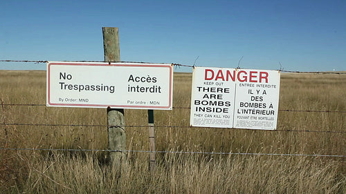 No Tresspassing & There are Bombs Inside signs. HD.