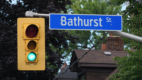 Bathurst St. Stoplight turns red to green. Residential area in Toronto, Canada. 4K.