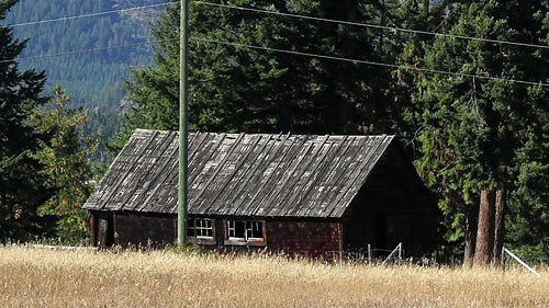 Rural wooden farm building with heatshimmer. HD.
