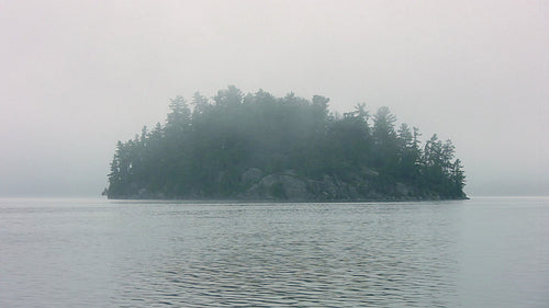 Mysterious, misty island. Muskoka, Ontario, Canada. HDV footage. HD.