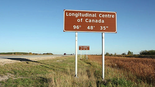 Longitudinal center of Canada sign. Traffic passing. HD.