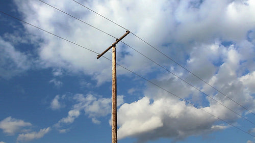 Utility telephone pole with clouds. Light time lapse. HD.