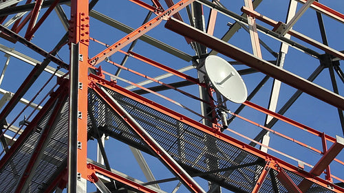 Red and white communication tower. Dish detail. HD.