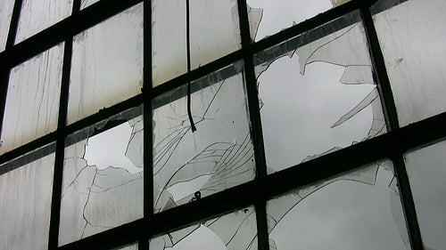 Broken factory window. Time lapse clouds. HD video.