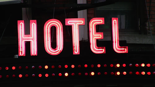 Old hotel sign. Red neon with blinking lights. Toronto, Canada. HD video.