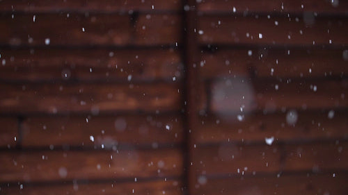 Winter snow with log cabin background. Slow motion snow falling. Winter in Canada. HD.