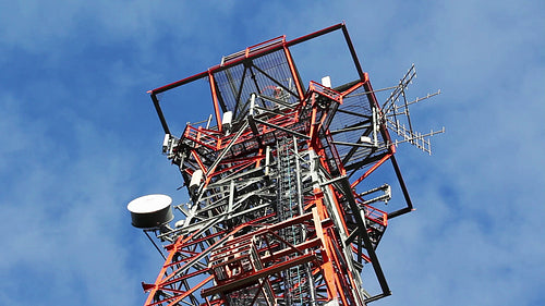Red and white communication tower. Detail. Time lapse. HD.