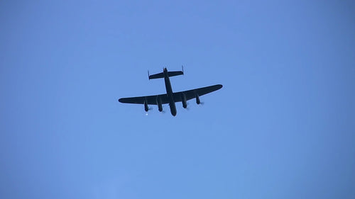 Avro Lancaster flies overhead. HDV footage. HD.