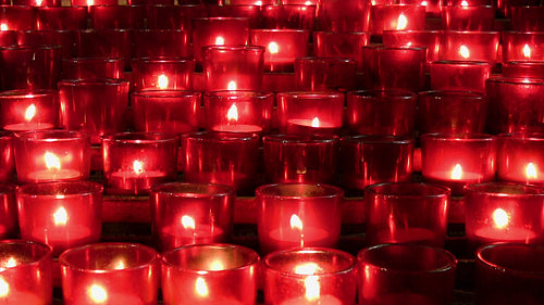Lots of red church candles. HDV footage. HD.