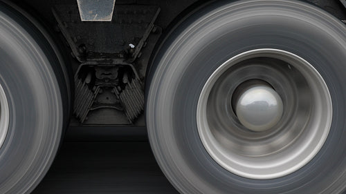 Closeup of truck wheels and tires with suspension. 4K.