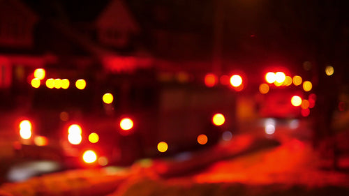 Firetruck responds to call in suburban neighborhood. Defocused lights. 4K.