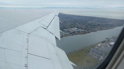 Flying out of Vancouver on a commercial airliner. HD.