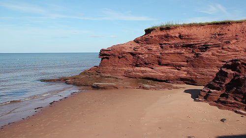 Red rock beach. Wide. Prince Edward Island, Canada. HD.
