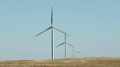 Three wind turbines in rural area. Manitoba, Canada. HD.