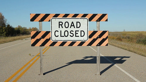 Road closed sign on abandoned road. Saskatchewan, Canada. HD.