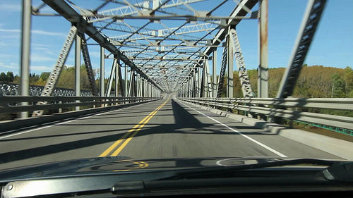 Driving across a long truss bridge. Northern Ontario, Canada. HD.