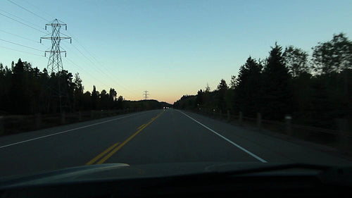 Dusk drive. Silhouettes of trees. Passing truck. Northern Ontario. HD.