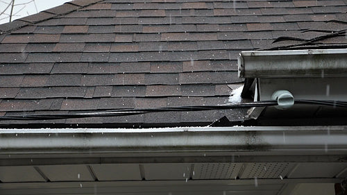 Slow motion ice pellets falling on roof. Winter in Toronto, Canada. HD.