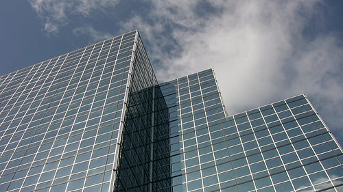 Mirrored office tower with three peaks. Real time clouds. Toronto, Canada. HDV footage. HD