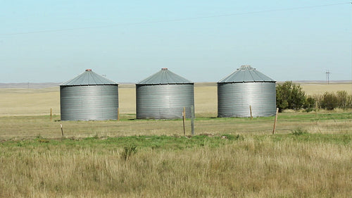Three grain silos. Alberta, Canada. HD.