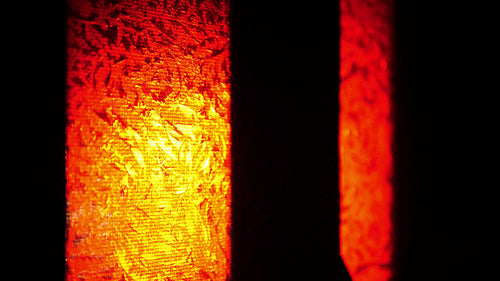Flashing red & orange lights of firetruck seen through glass in front door. Emergency. 4K.