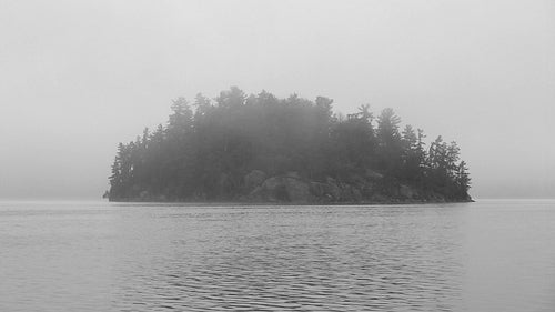 Mysterious, misty island. Black and white. Muskoka, Ontario, Canada. HDV footage. HD.