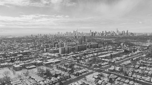 Snowy Toronto cityscape. East York in the foreground. Black and white. 4K.