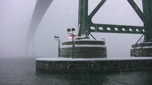 Lions Gate bridge detail. Snowstorm in Vancouver, BC, Canada. HD video.