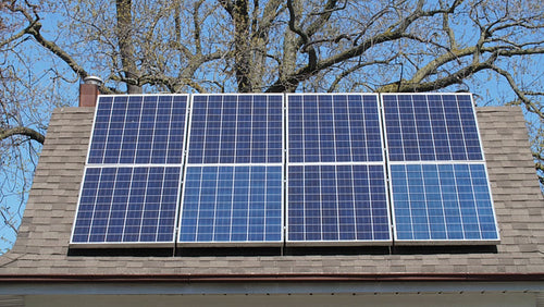 Solar panels on roof of suburban house or home. Toronto, Ontario, Canada. 4K.