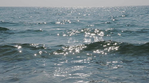 Beautiful slow motion cresting sunlit waves. Shore of Lake Ontario, Canada. HD video.