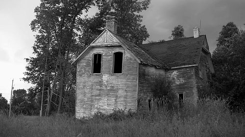 Haunted house. Abandoned farmhouse in rural Ontario. Black and white. HD.