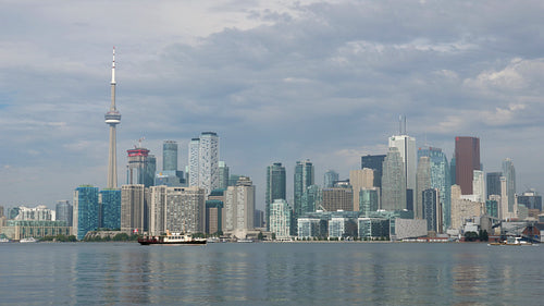 Toronto skyline on summer morning with boat. Toronto, Ontario, Canada. 4K stock video.
